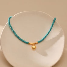 Load image into Gallery viewer, MSCHA HOME necklace, natural wood bead necklace with gold heart shaped jewelry