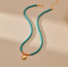 Load image into Gallery viewer, MSCHA HOME necklace, natural wood bead necklace with gold heart shaped jewelry