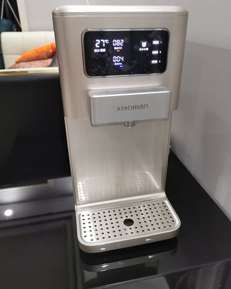 xiaoman water dispenser can adjust the temperature, heat and cool, and make coffee. Water out quickly.